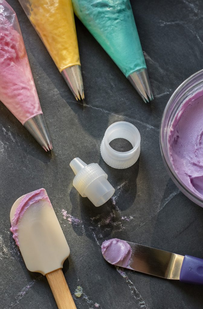 A piping bag coupler used for swapping tips easily.
