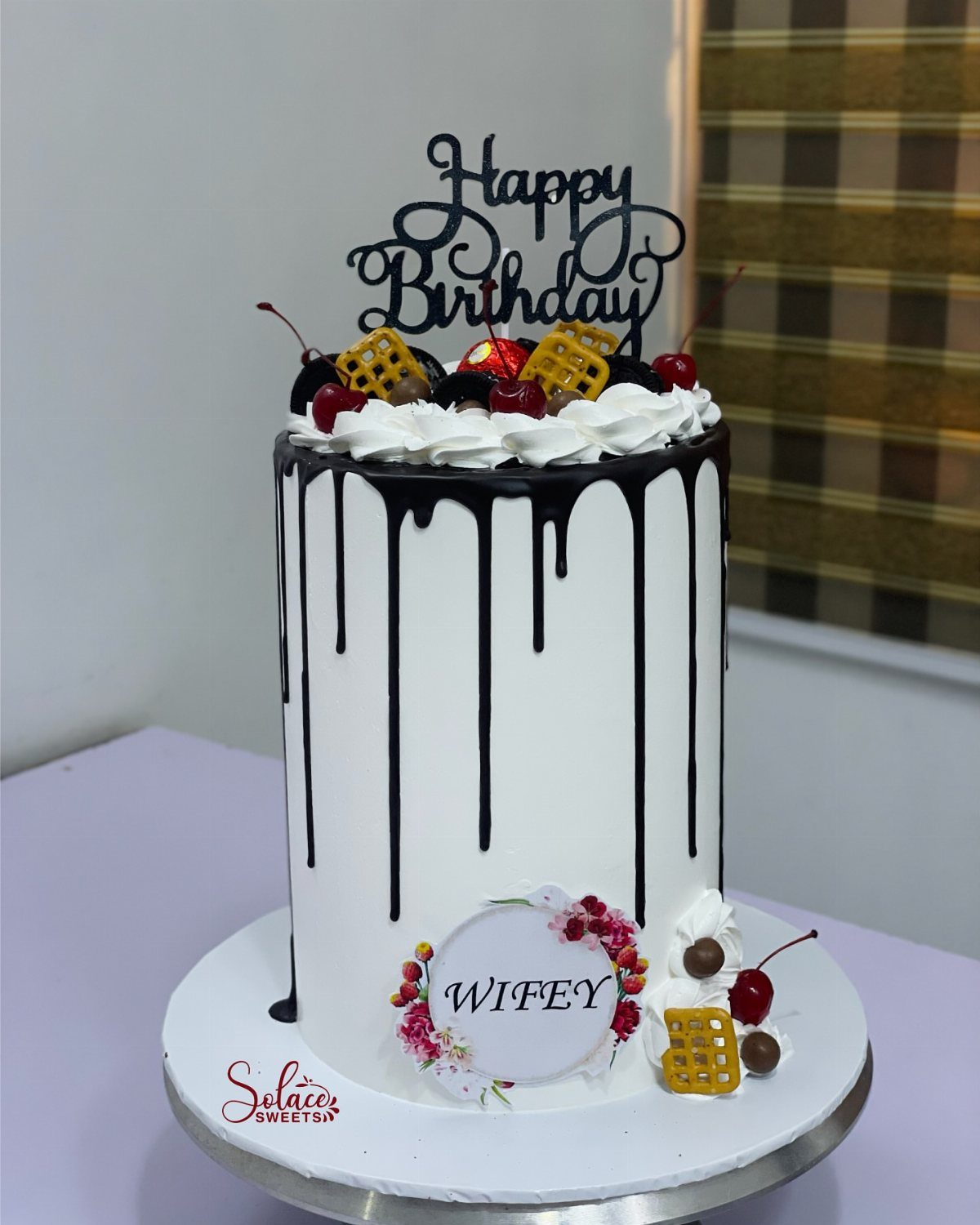 21 Cake Decoration Ideas for Every Skill Level 15 White frosted cake with chocolate ganache drip, cherries, and Happy Birthday topper.