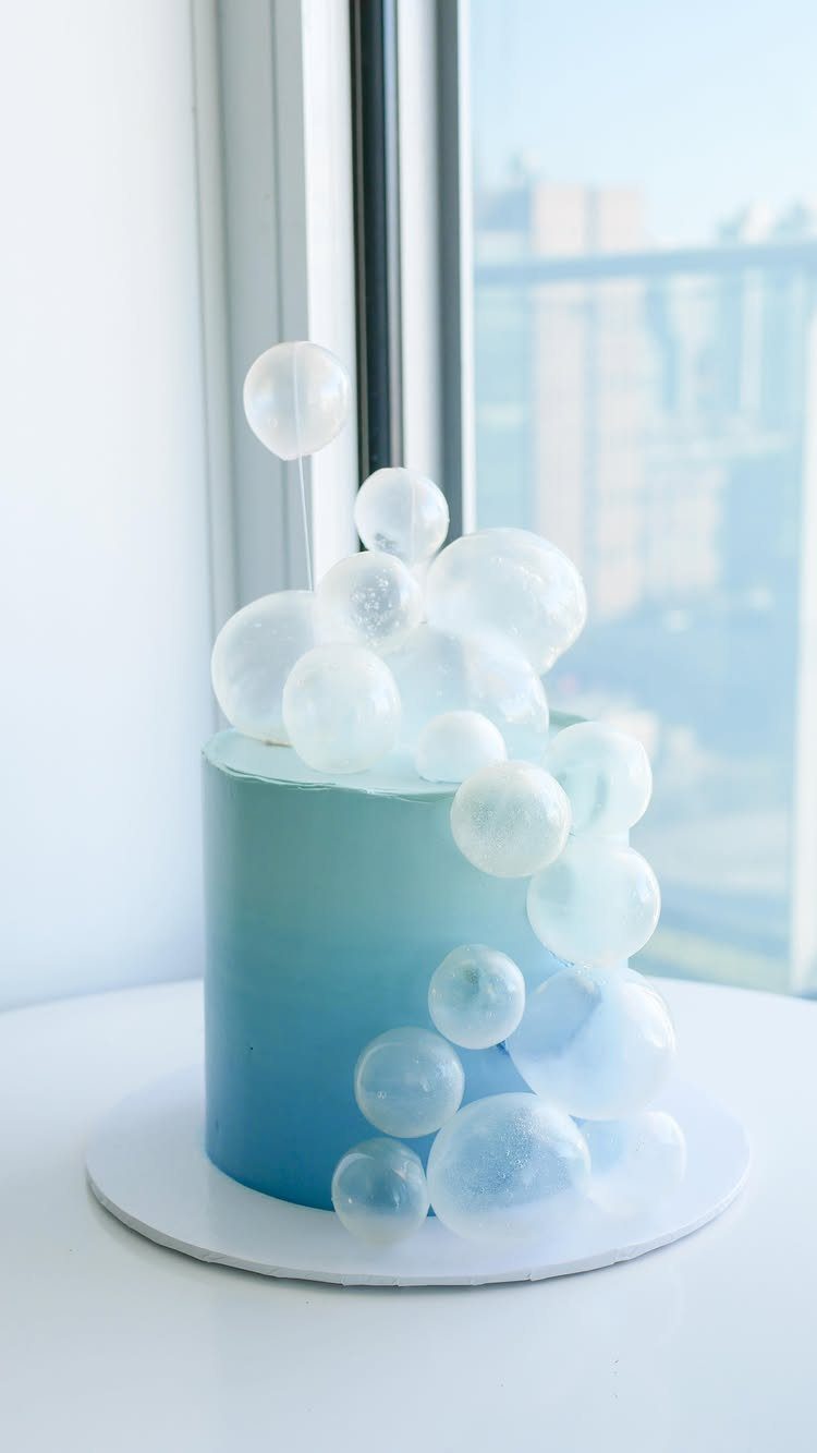 21 Cake Decoration Ideas for Every Skill Level 17 Blue gradient cake decorated with clear, translucent gelatin bubbles cascading down the side.