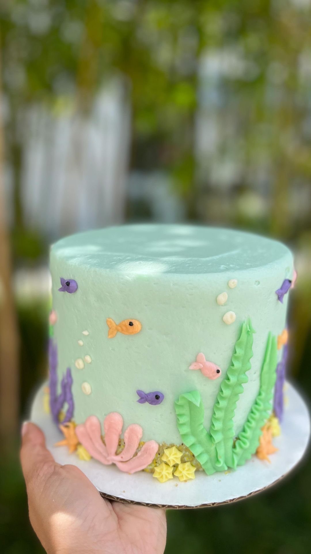 Animal Themed Birthday Cake: 9 Party Designs from Farm to Fantasy 4 Light blue cake decorated with frosting fish, seaweed, and coral for underwater theme.